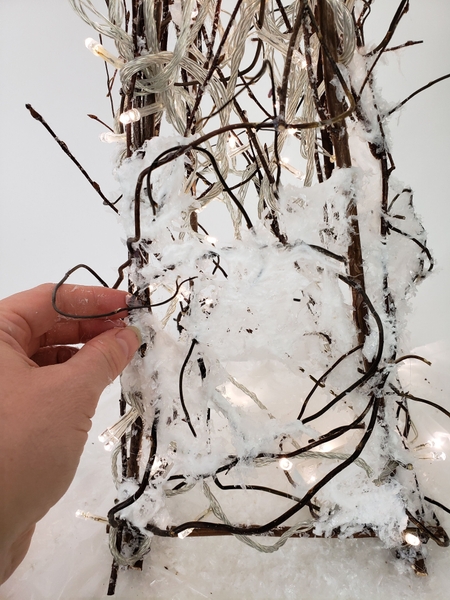 Once the cotton is secure add the artificial snow Once the cotton is secure add the artificial snow