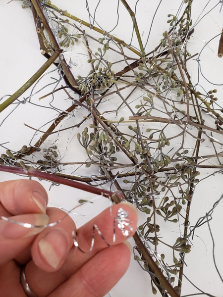 Secure the stem to the wire with tinsel Secure the stem to the wire with tinsel