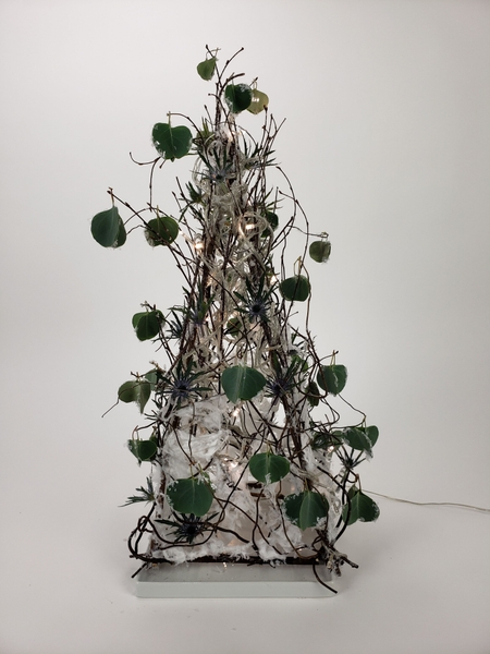 Use twigs to make a table top Christmas tree