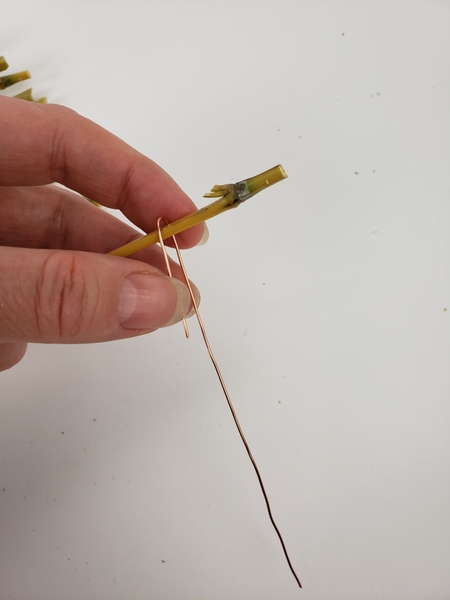 Bend wire around the bamboo Bend wire around the bamboo