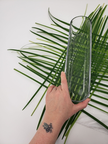 Measure your container to make sure you have a big enough section of woven grass Measure your container to make sure you have a big enough section of woven grass