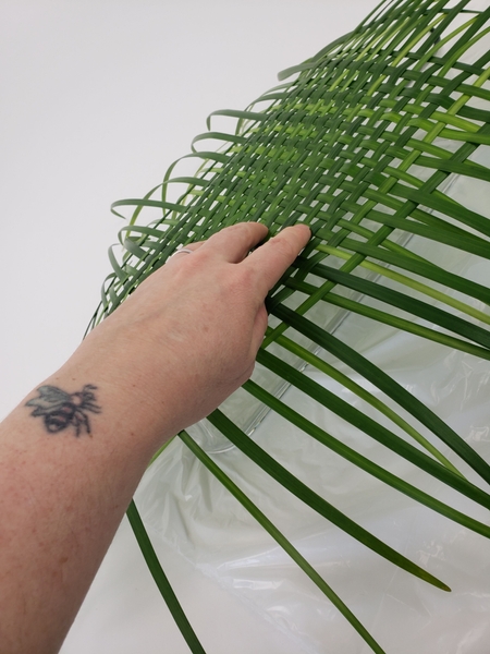 Place the grass weave on your container Place the grass weave on your container