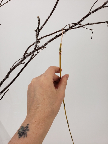 Simply hook the bamboo sections over the branch to hang Simply hook the bamboo sections over the branch to hang