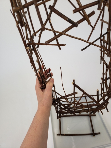 Fit the pillar armature on the four twigs so that it stands upright on its own Fit the pillar armature on the four twigs so that it stands upright on its own
