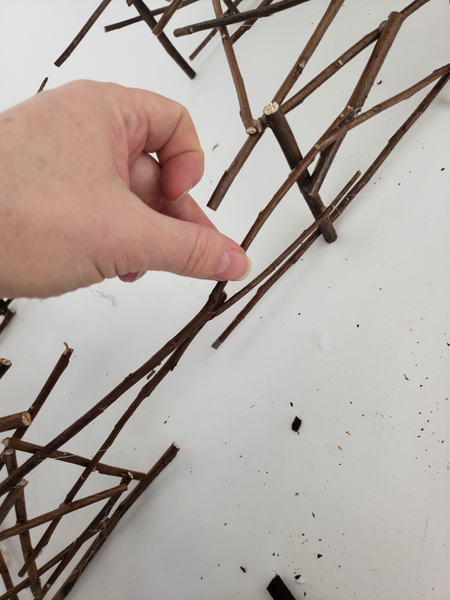 Glue in twigs that reaches over the gap