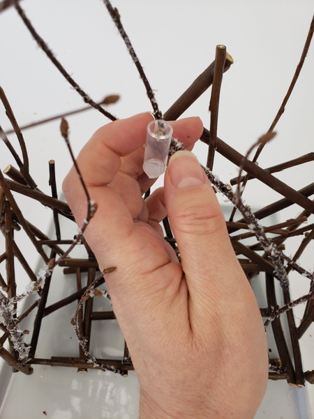 Glue in water tubes to keep the orchids hydrated Glue in water tubes to keep the orchids hydrated