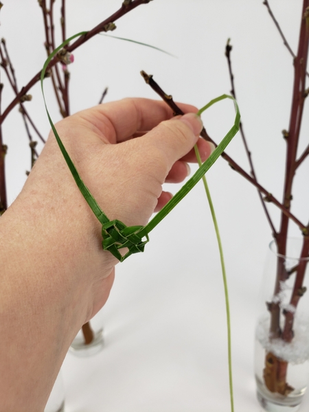 Hang the hearts between the two manipulated side branches Hang the hearts between the two manipulated side branches