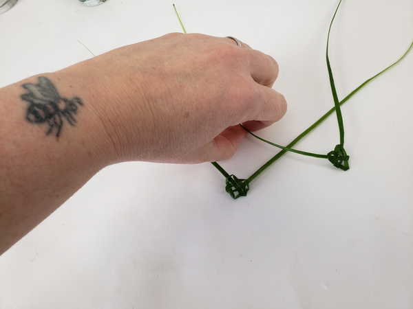 How to weave little hearts from palm leaves of grass