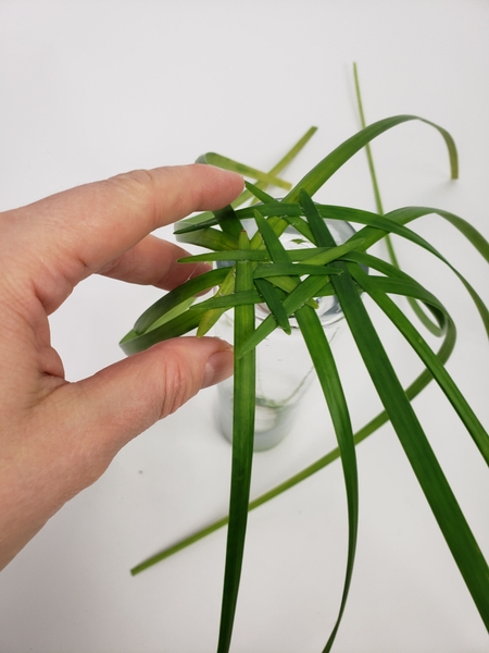 Leave a gap for the tulip stem in the grass weave Leave a gap for the tulip stem in the grass weave