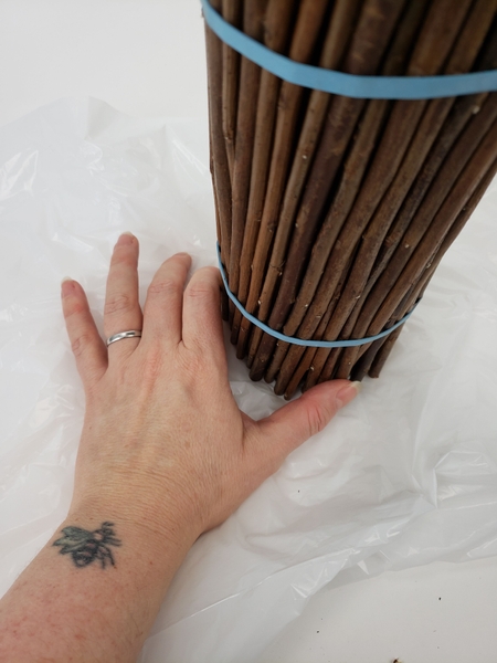 Place the twigs on a layer of plastic to catch the glue drips Place the twigs on a layer of plastic to catch the glue drips