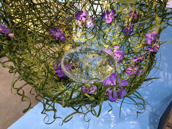 Dropping a single drop of water into a vase floral design Dropping a single drop of water into a vase floral design