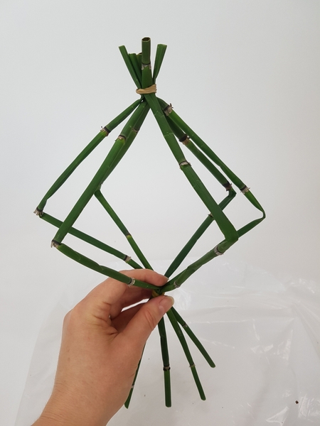 Gather and secure the second leg with an elastic band Gather and secure the second leg with an elastic band