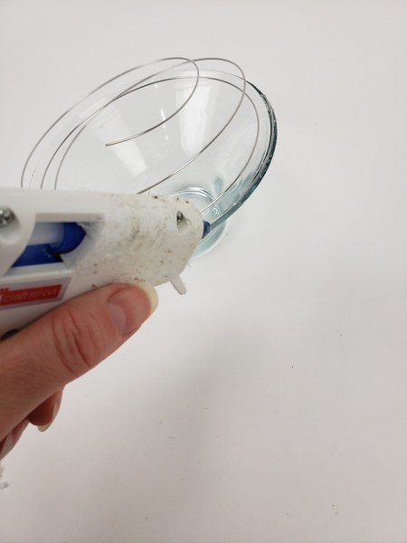 Glue the wire to the container using hot glue Glue the wire to the container using hot glue