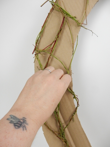 Make small bundles of twigs by manipulating the stems Make small bundles of twigs by manipulating the stems