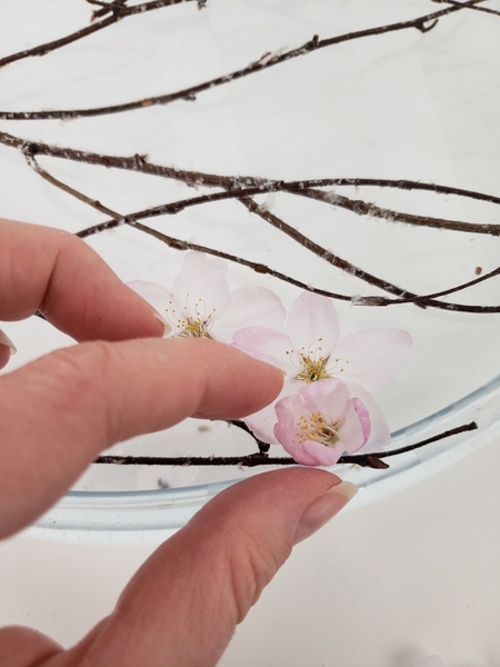 Add in tiny buds to rest between the blossoms Add in tiny buds to rest between the blossoms
