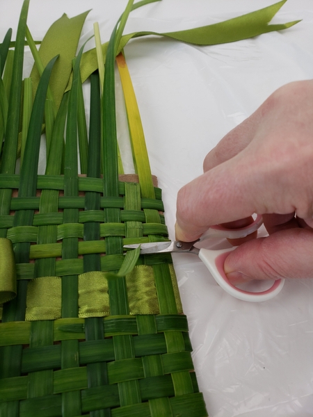 And snip the left over grass away And snip the left over grass away