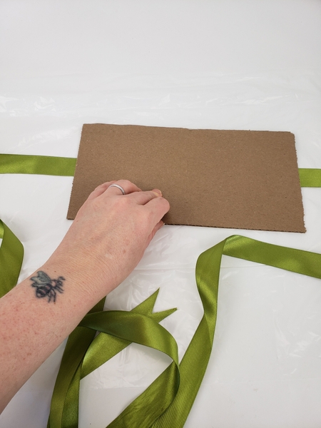 Cut a sturdy cardboard template in the size that you want the purse to be Cut a sturdy cardboard template in the size that you want the purse to be