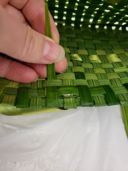Do the same with the other strands of grass Do the same with the other strands of grass