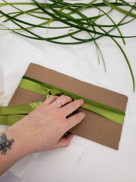 Move the grass towards the ribbon Move the grass towards the ribbon