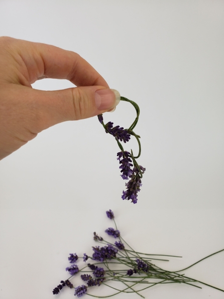 Add the next lavender flower and knot Add the next lavender flower and knot