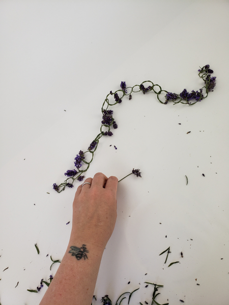 Crafting a long and continuous lavender garland.