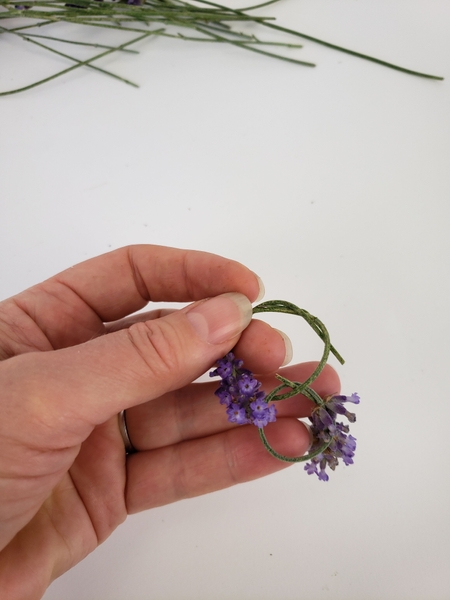 Knot the stem and continue to weave it around the circle Knot the stem and continue to weave it around the circle