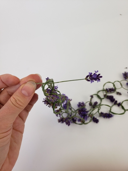 Knot the two ends together with a lavender flower Knot the two ends together with a lavender flower