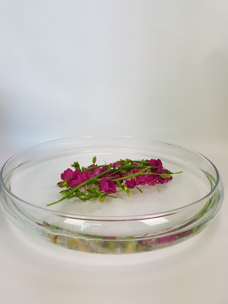 Make a flower arrangement that floats on water Make a flower arrangement that floats on water