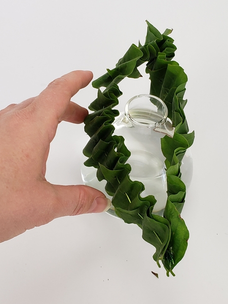 Slip the ruffles over the neck of a bud vase Slip the ruffles over the neck of a bud vase