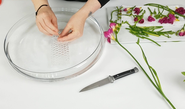 Use a wooden skewer to make a hole in the bubble wrap