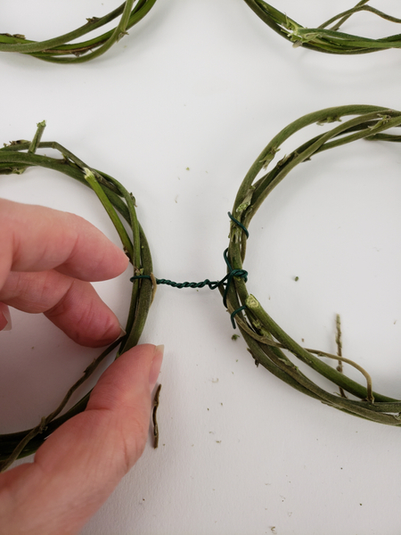 Fold the wire ends in and around the wreath so that it can't catch on anything