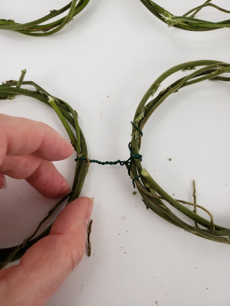 Fold the wire ends in and around the wreath so that it can't catch on anything Fold the wire ends in and around the wreath so that it can't catch on anything