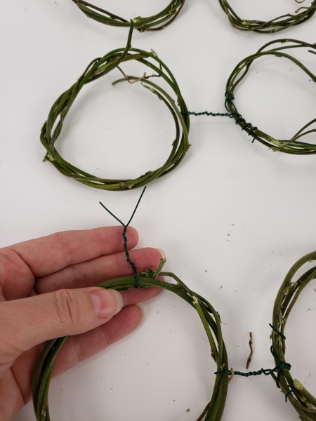 The next step is to connect the pairs of wreaths The next step is to connect the pairs of wreaths
