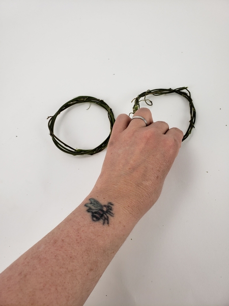 Weave another wreath and place it next to the first one Weave another wreath and place it next to the first one