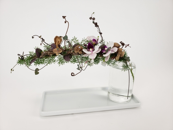 Design a floral arrangement in a small bud vase Design a floral arrangement in a small bud vase