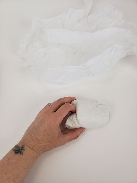 Fold over some tissue paper to prop up the flip flop ribbon Fold over some tissue paper to prop up the flip flop ribbon