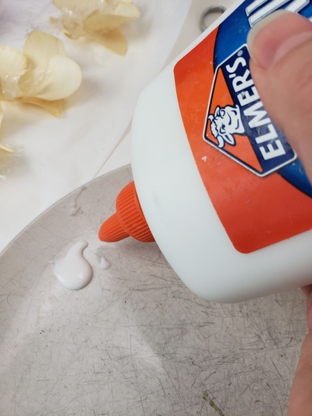 Pour out a small amount of wood glue onto a plate Pour out a small amount of wood glue onto a plate