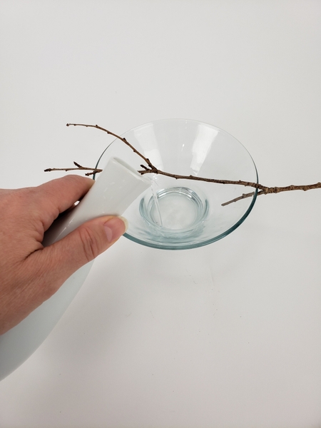 Add water to the container Add water to the container