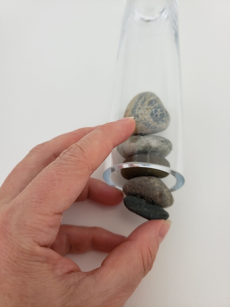Keep the vase on its side and push each pebble in with the next. Keep the vase on its side and push each pebble in with the next.