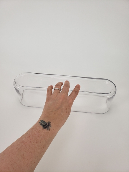 Place an oblong glass container upside down Place an oblong glass container upside down