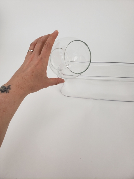 Release the vase so that it settles Release the vase so that it settles