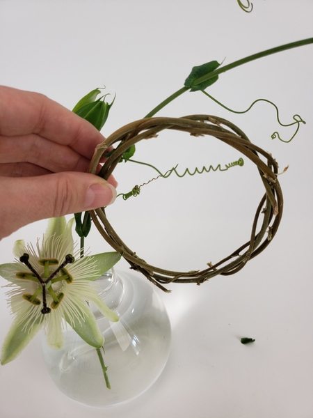 Thread the vine through the first wreath Thread the vine through the first wreath