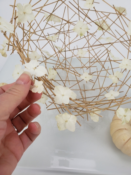 Glue in a few dried hydrangea florets Glue in a few dried hydrangea florets