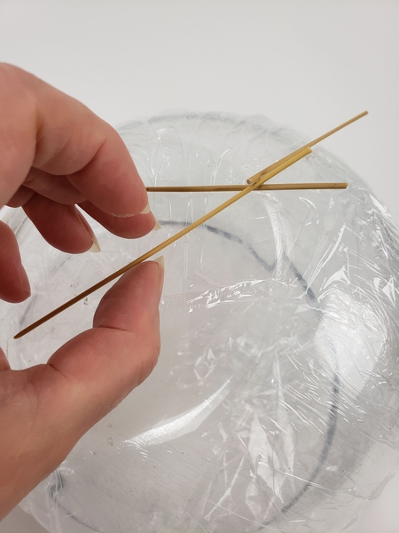 Glue the first reeds to the bowl shape