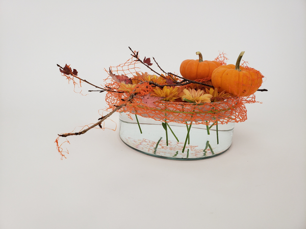 Quick and easy way to use supermarket flowers in a Fall flower arrangement