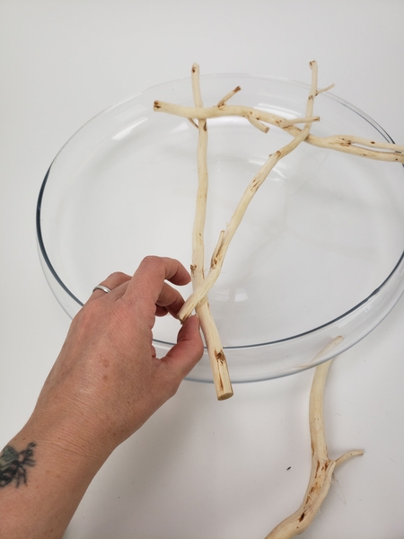 As you build up the willow grid secure the twigs with hot glue As you build up the willow grid secure the twigs with hot glue
