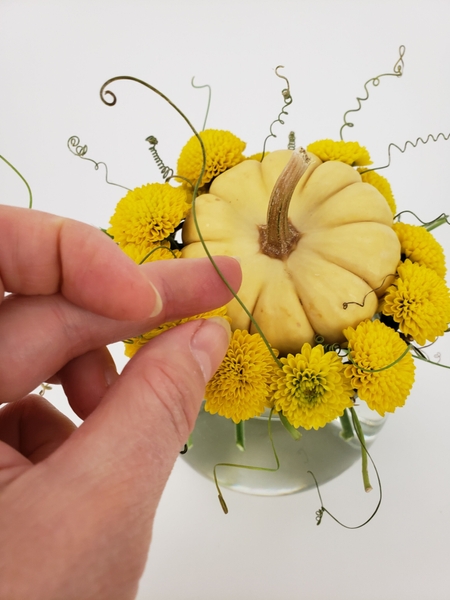 Lift out and reposition all the tendrils so that it gives the design more height Lift out and reposition all the tendrils so that it gives the design more height