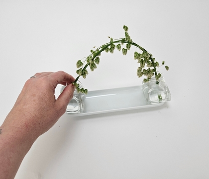 Curve a handful of grass to twist into place Curve a handful of grass to twist into place